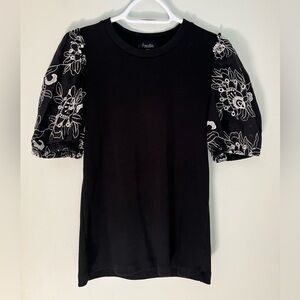 SUZANNE’S FASHIONS black scoop neck top with white embroidered eyelet sleeves